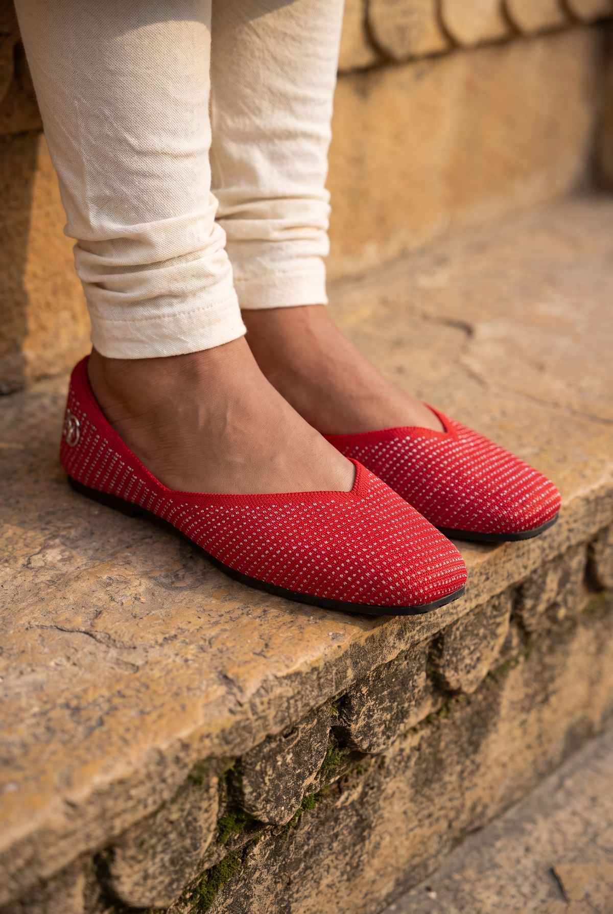 Sitara Juttis Red Silver foot closeup on Indian woman in traditional churidar