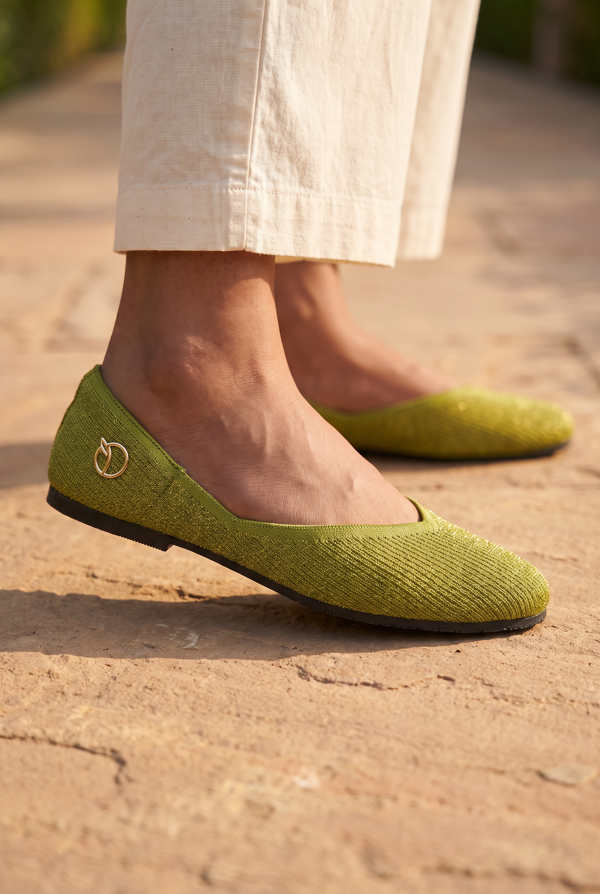Sitara Juttis Green Gold foot closeup on Indian woman in traditional palazzo