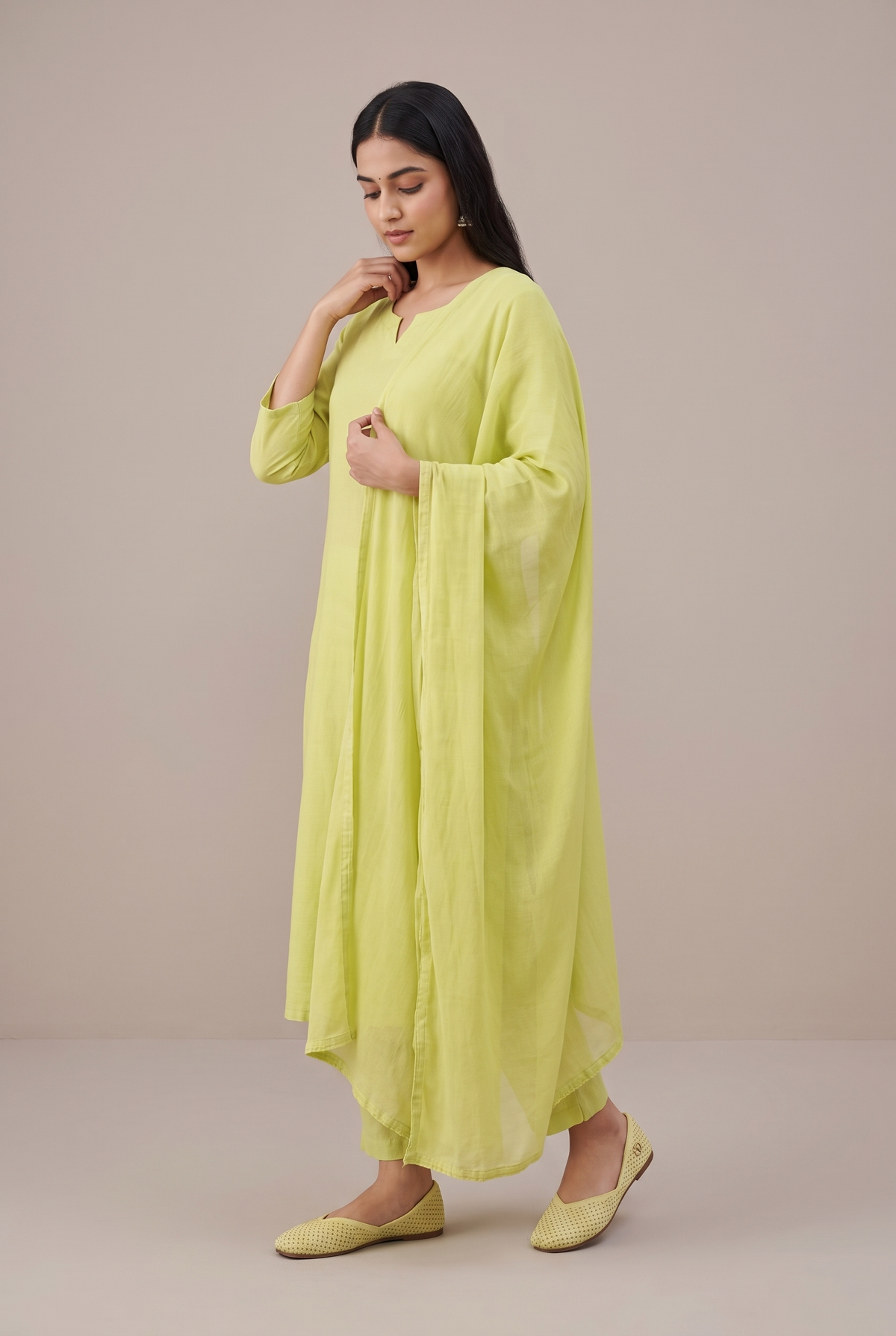 Rioz Noor lime gold shimmer jutti worn with a tonal lime kurta set