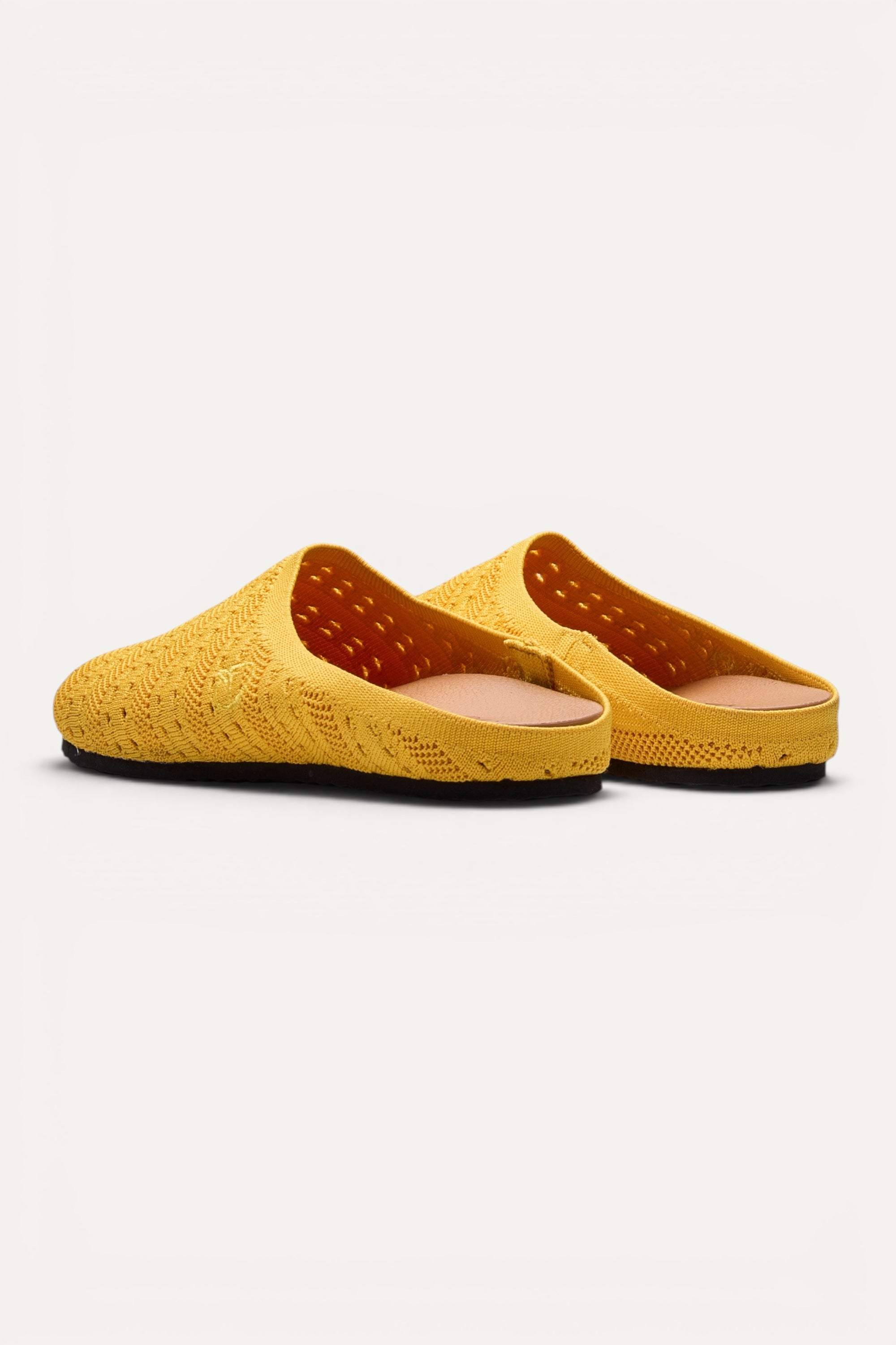 Rioz Lumi Mules in yellow, vegan closed-toe knit clogs from 10 recycled PET bottles, made in India.