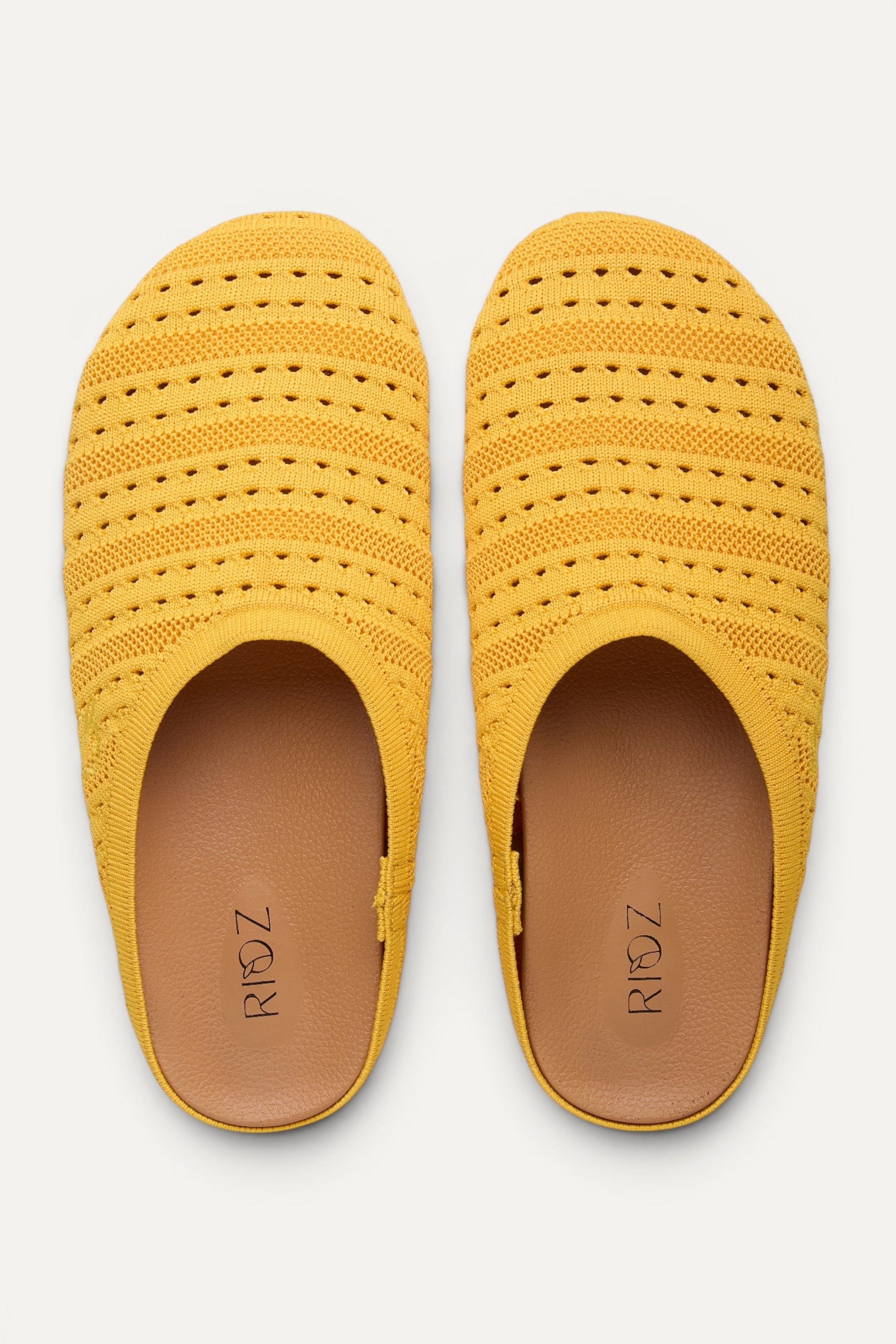 Rioz Lumi Mules in yellow, vegan closed-toe knit clogs from 10 recycled PET bottles, made in India.